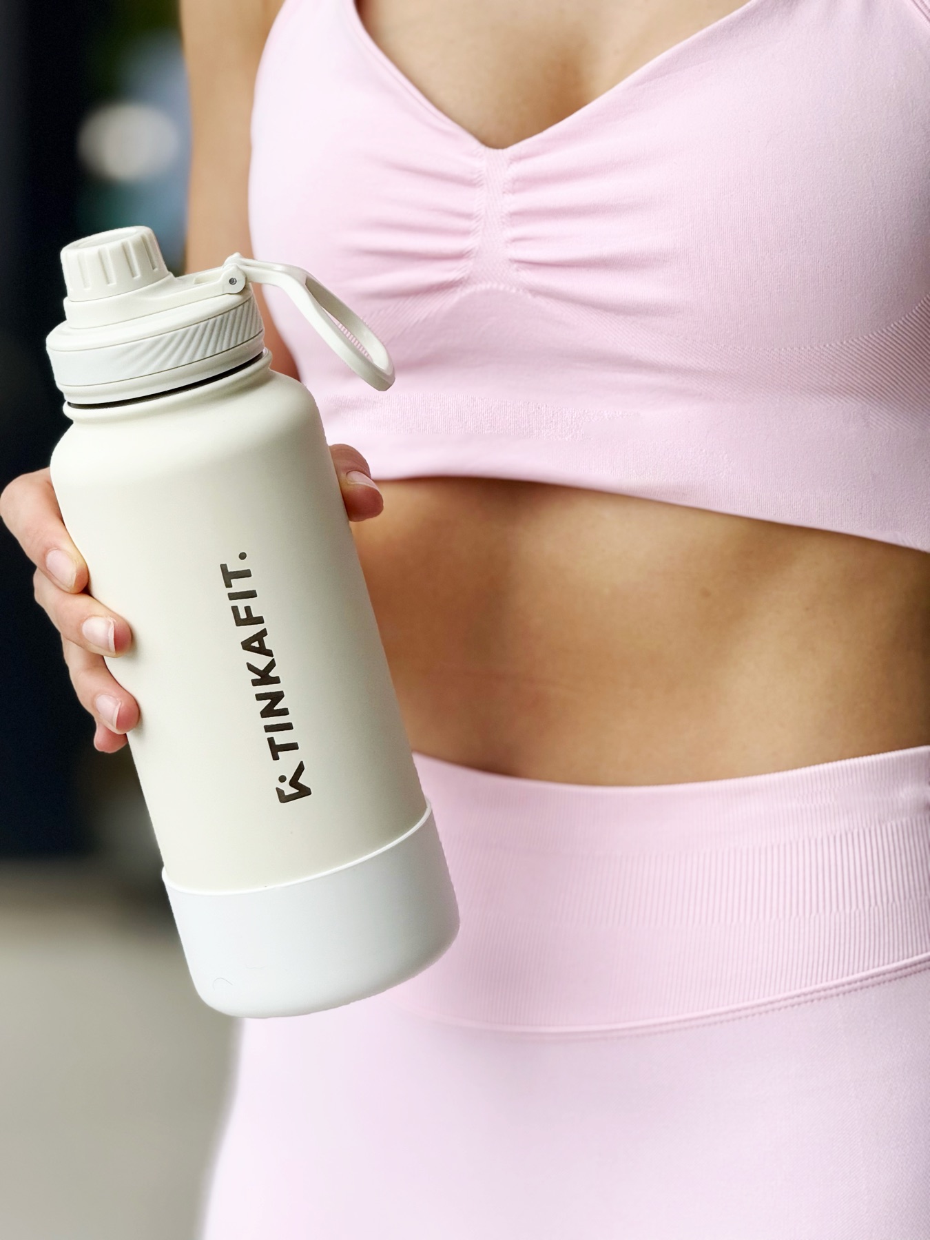 GlowRise Water Bottle held during an active wellness routine